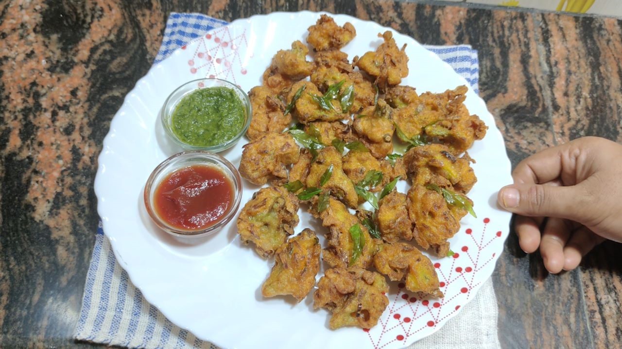 Cauliflower Pakoda is ready to serve with tomato ketchup  and green chutney