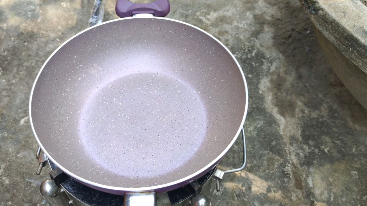 Putting a pan on the gas stove