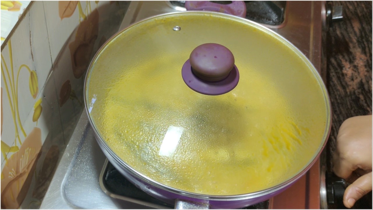 Covering the cooking pan with a lid