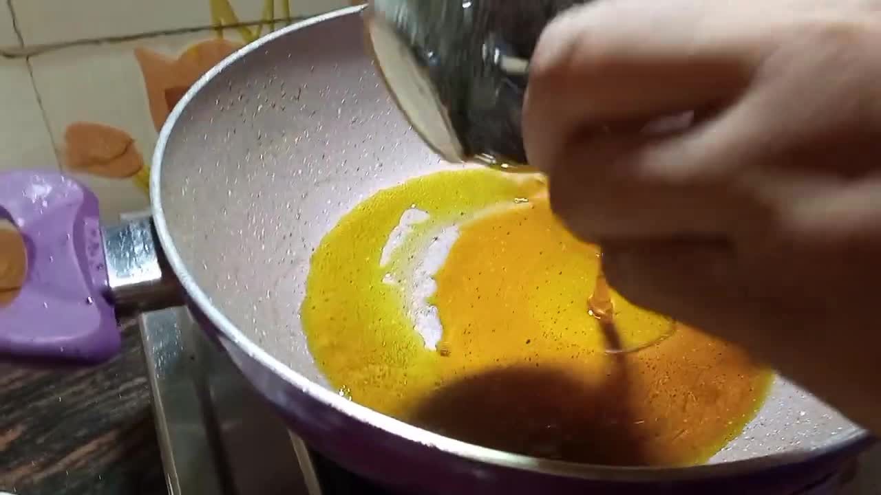 Adding more oil to the pan