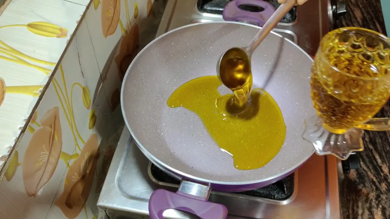 Pouring oil into the pan