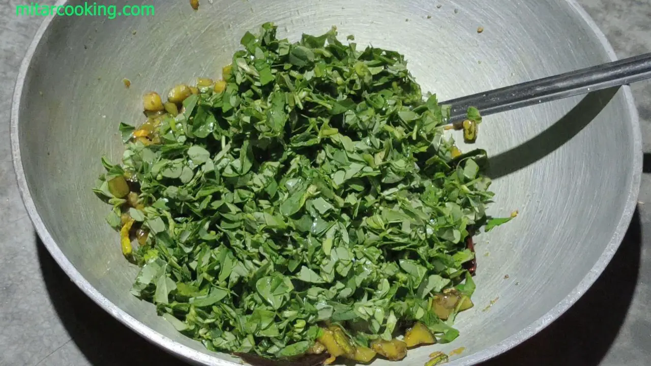 Adding the fenugreek greens