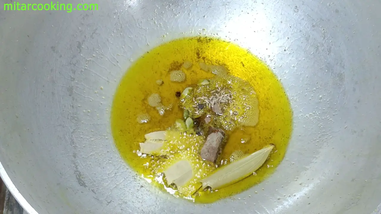Adding whole spices such as bay leaves, cumin seeds, cinnamon sticks, cardamom, black pepper