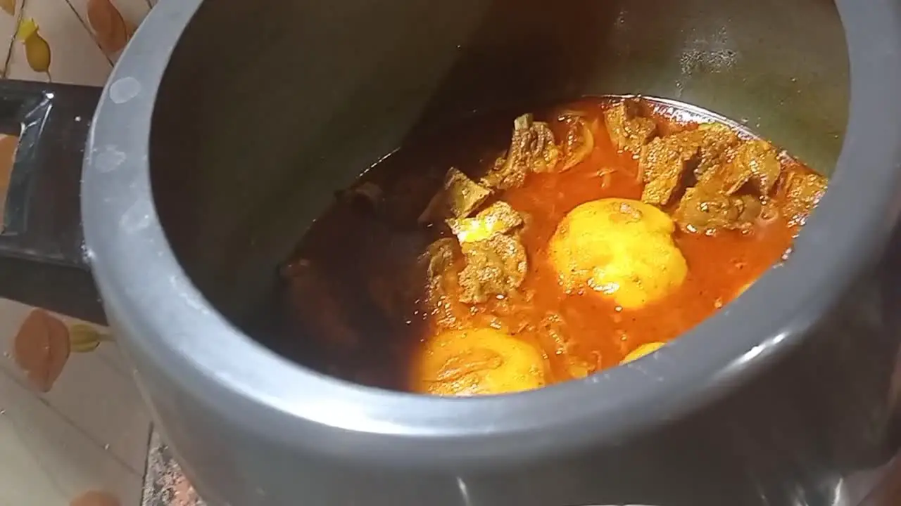 Carefully opening the pressure cooker lid