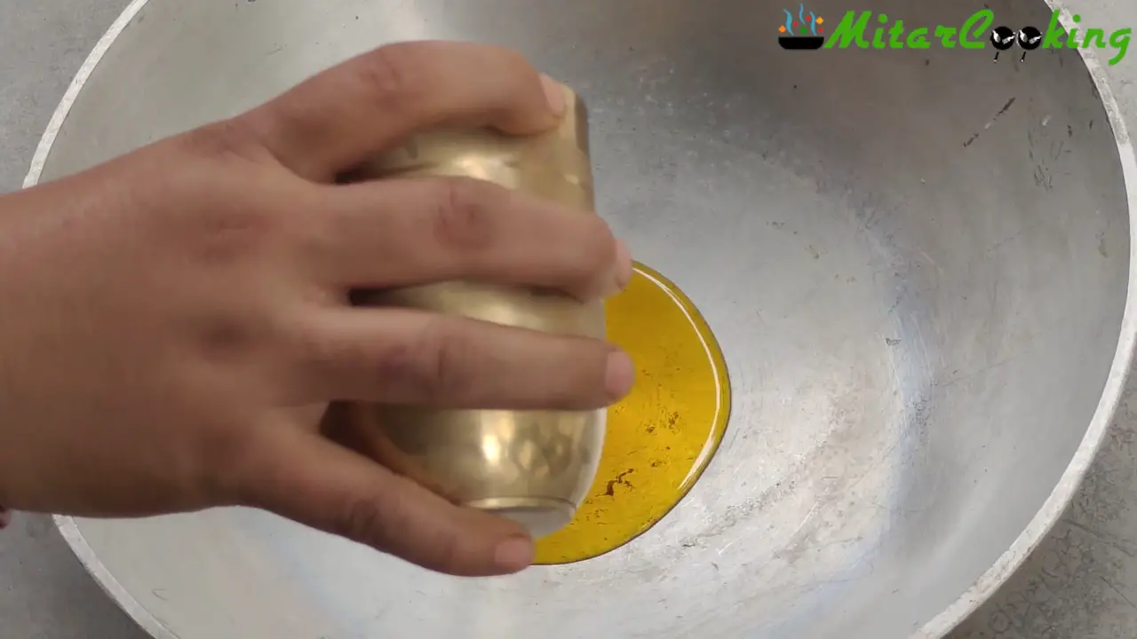 Pouring oil into the wok