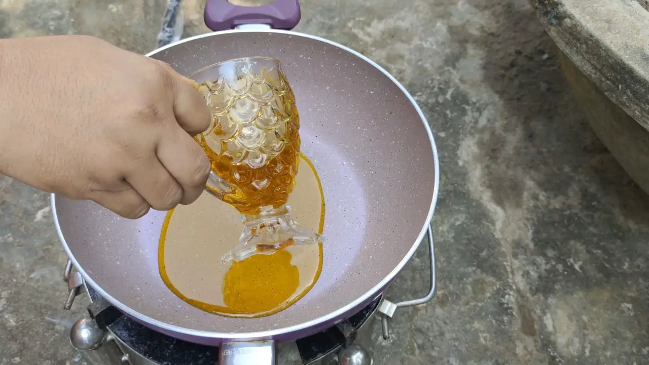 Pouring oil into the pan
