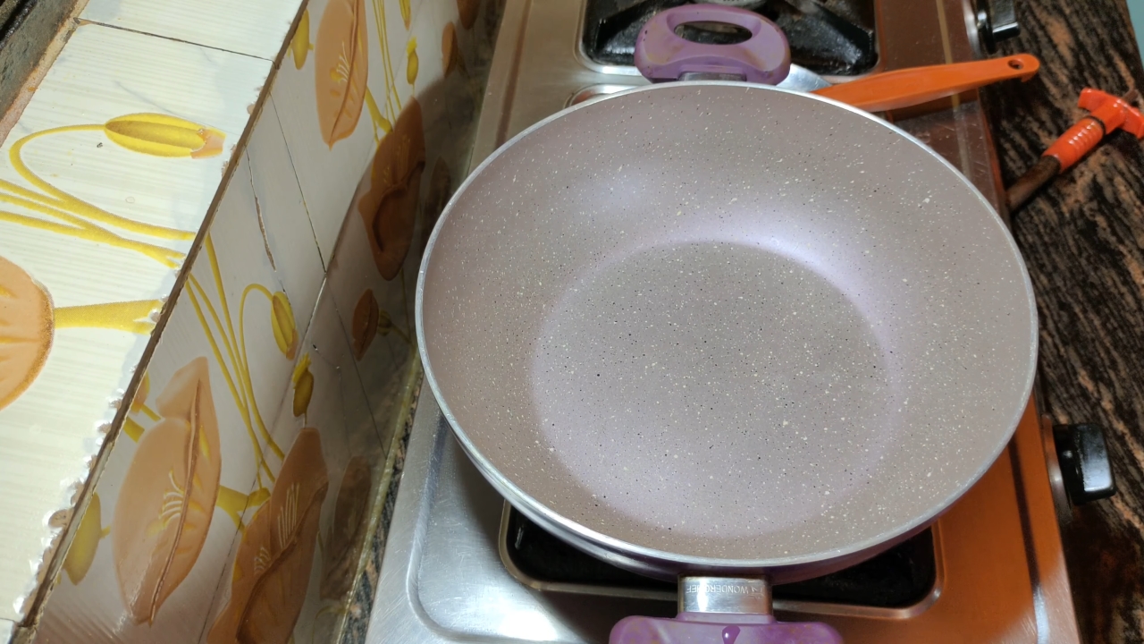 Placing a cooking pan on the gas stove