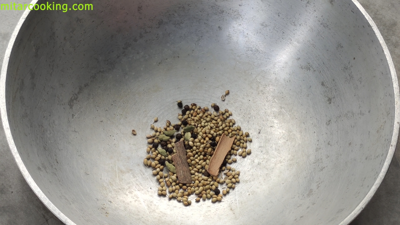 Dry roasting the whole spices (coriander seeds, cinnamon sticks, green cardamom and black pepper)