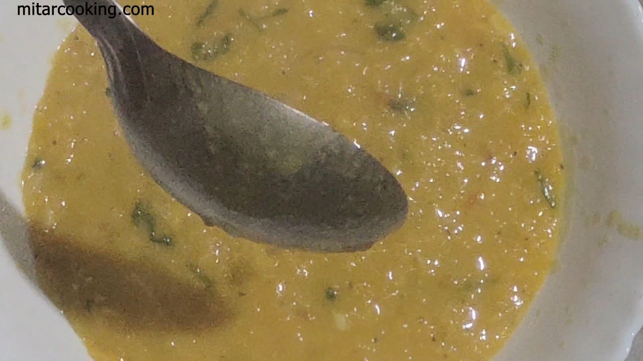 Pouring Home Style Masoor Dal in a bowl