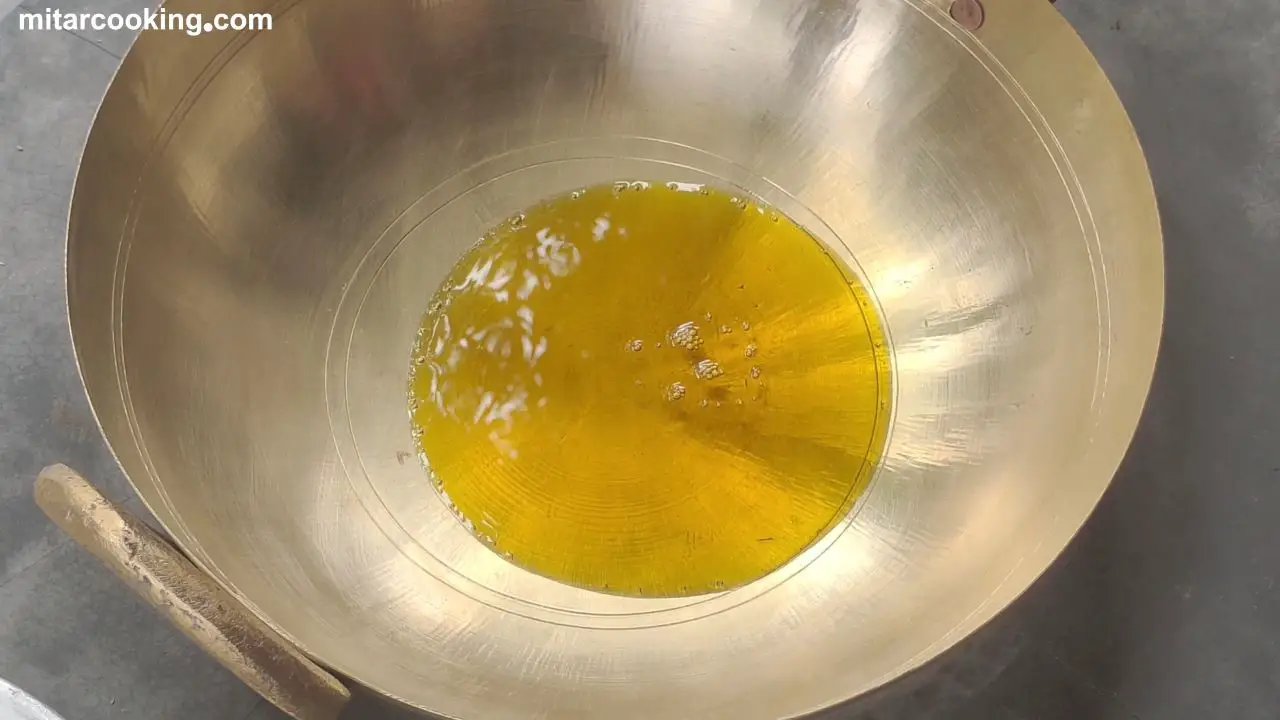 Adding oil and heating the wok