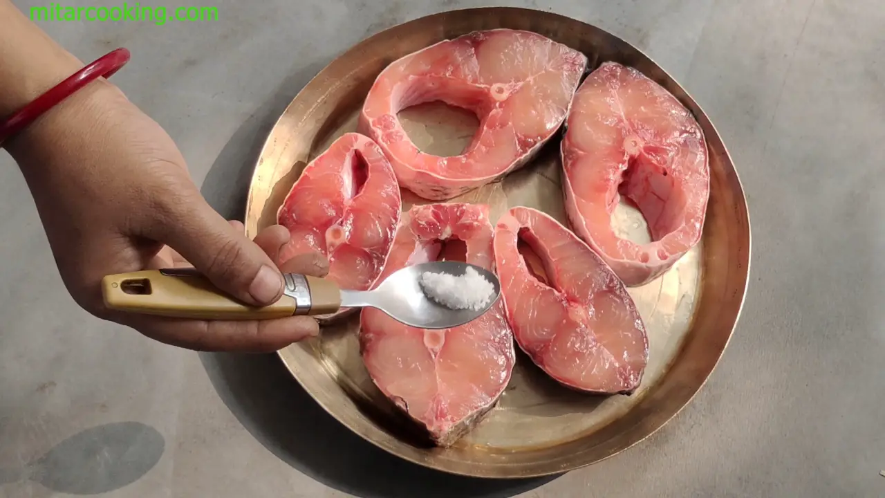 Marinating the fish pieces with pinch of salt