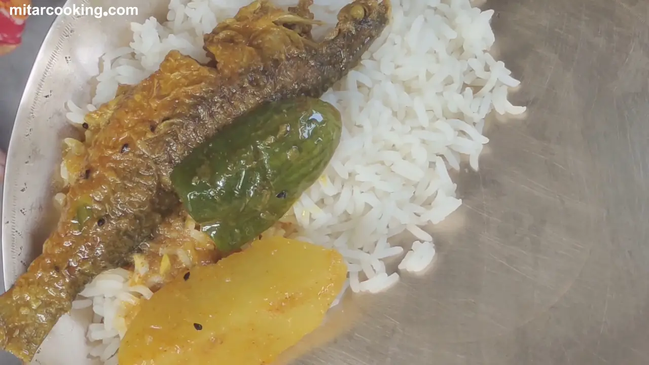 Serving with Aloo Begun Macher Jhol with Steamed Rice