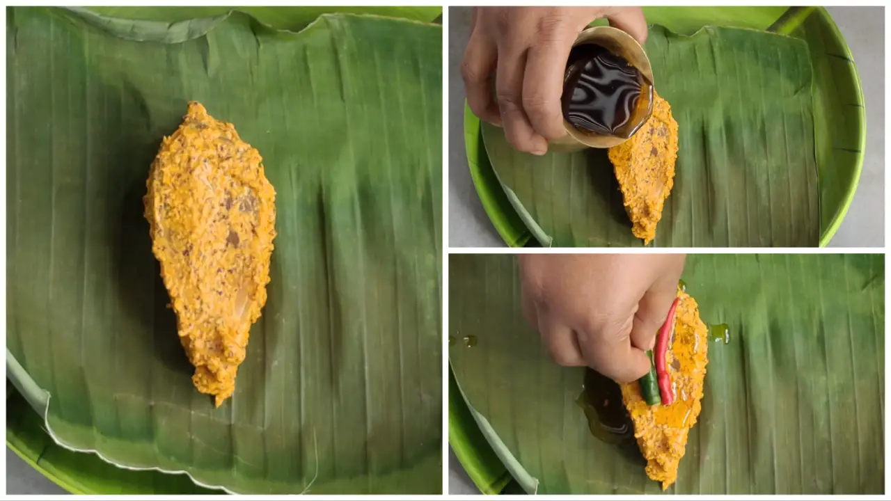 Placing each piece of fish on a separate banana leaf and add little bit of mustard oil, one green chili, and one red chili on it