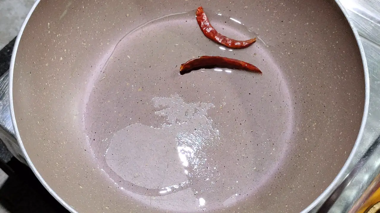 Add 2 dry red chillies