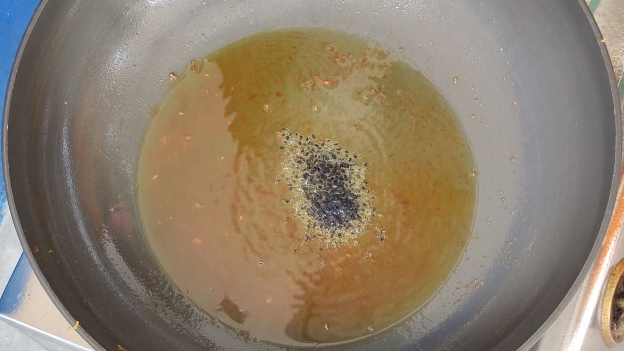 Add nigella seeds in the heated oil