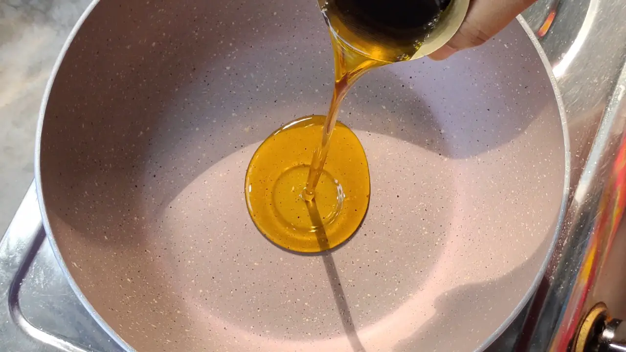 Heat mustard oil in a pan