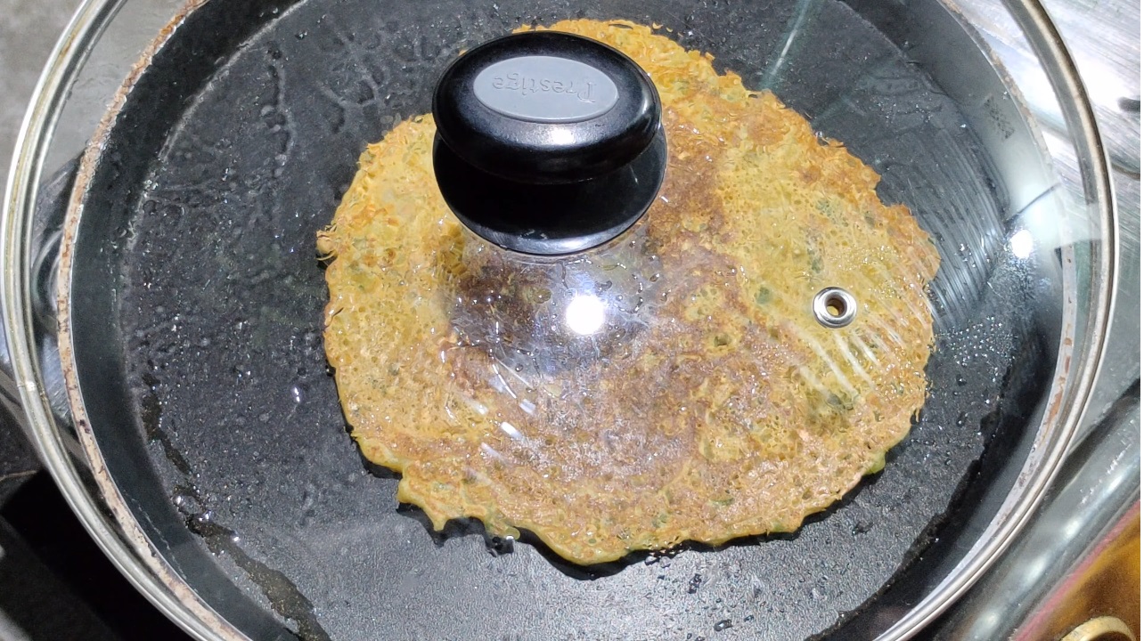 Cover the pan with a lid and cook for a few minutes