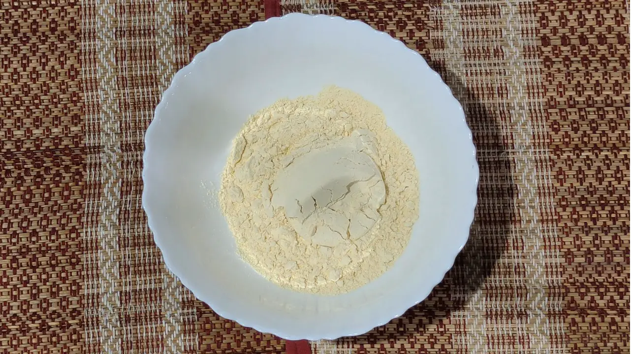 Pour besan in a bowl