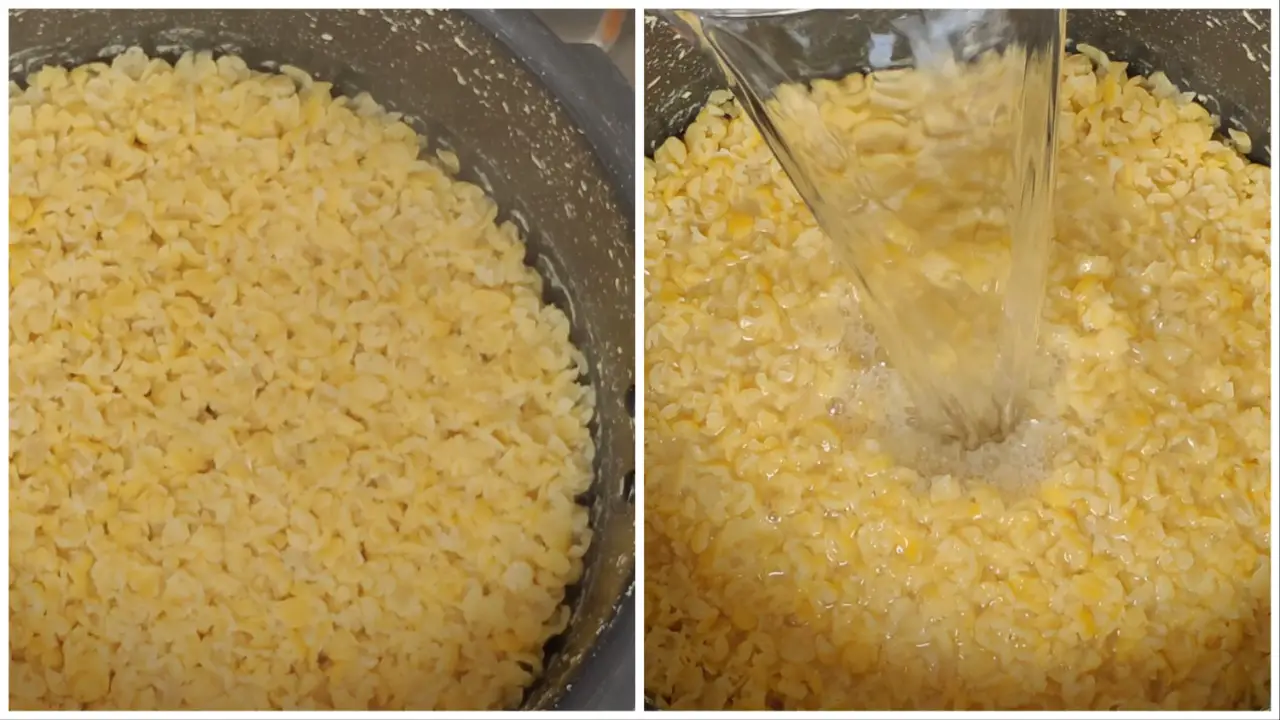 Adding hot water into the half boiled dried dal in pressure cooker
