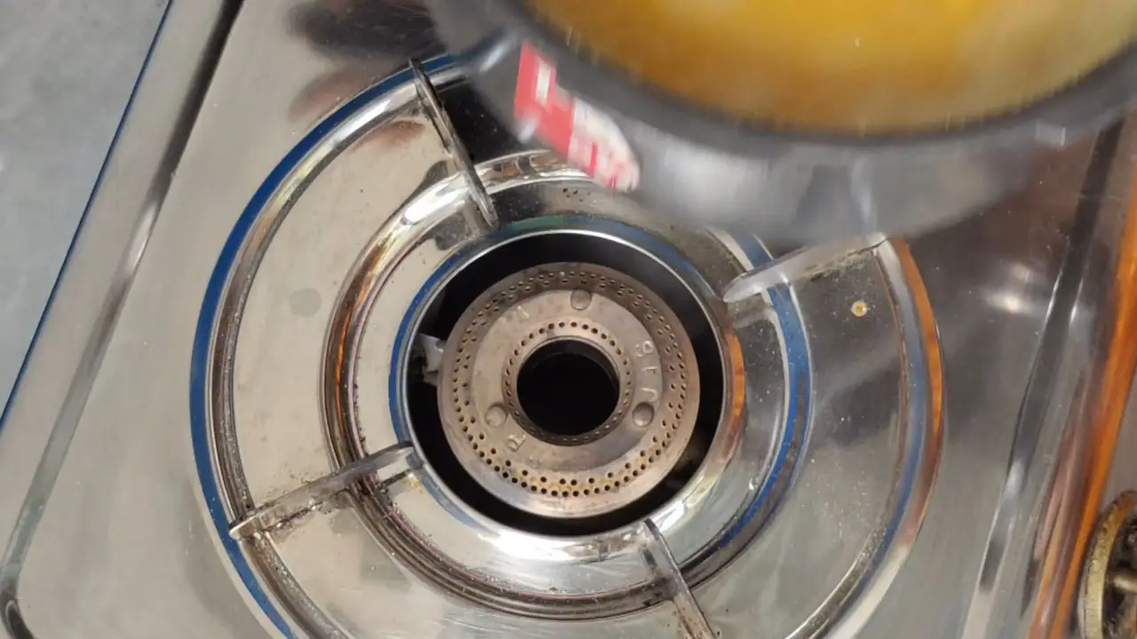 Take out the pressure cooker from the gas stove