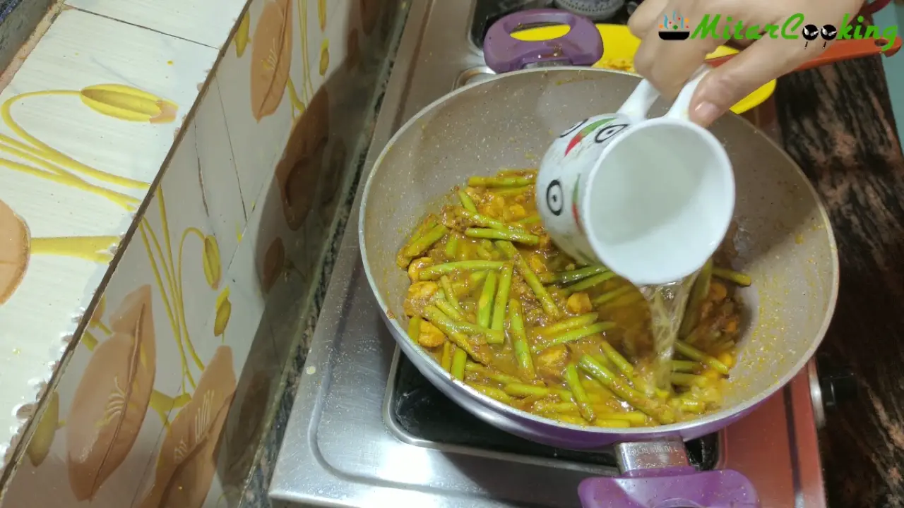Adding ½ cup of water into the wok