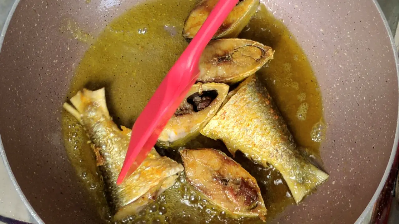 Flipping hilsa fish pieces