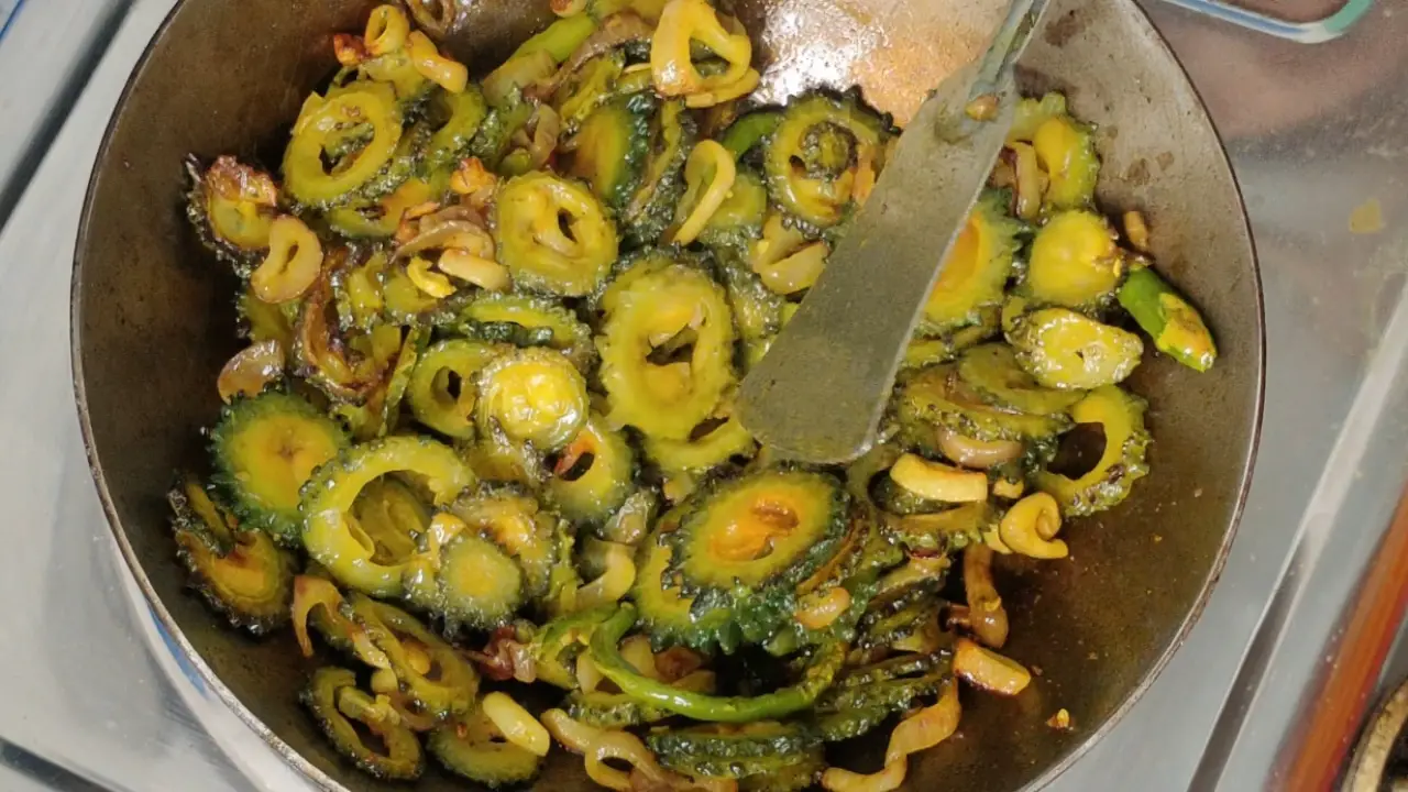 Stirring bitter gourd and onions