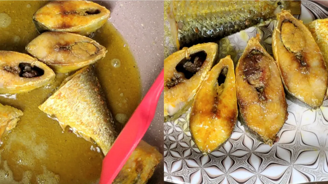 Taking out the fried Hilsa fish pieces