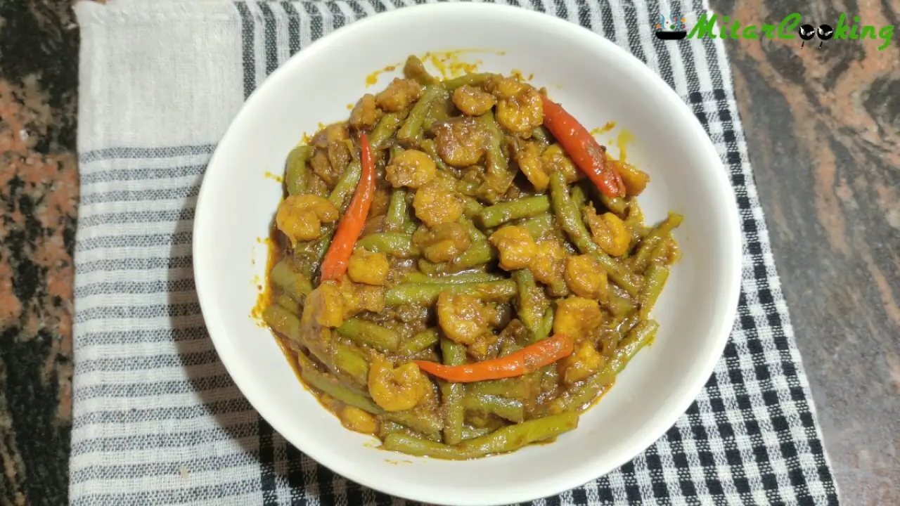 Transferring Kochur Loti Chingri to a bowl