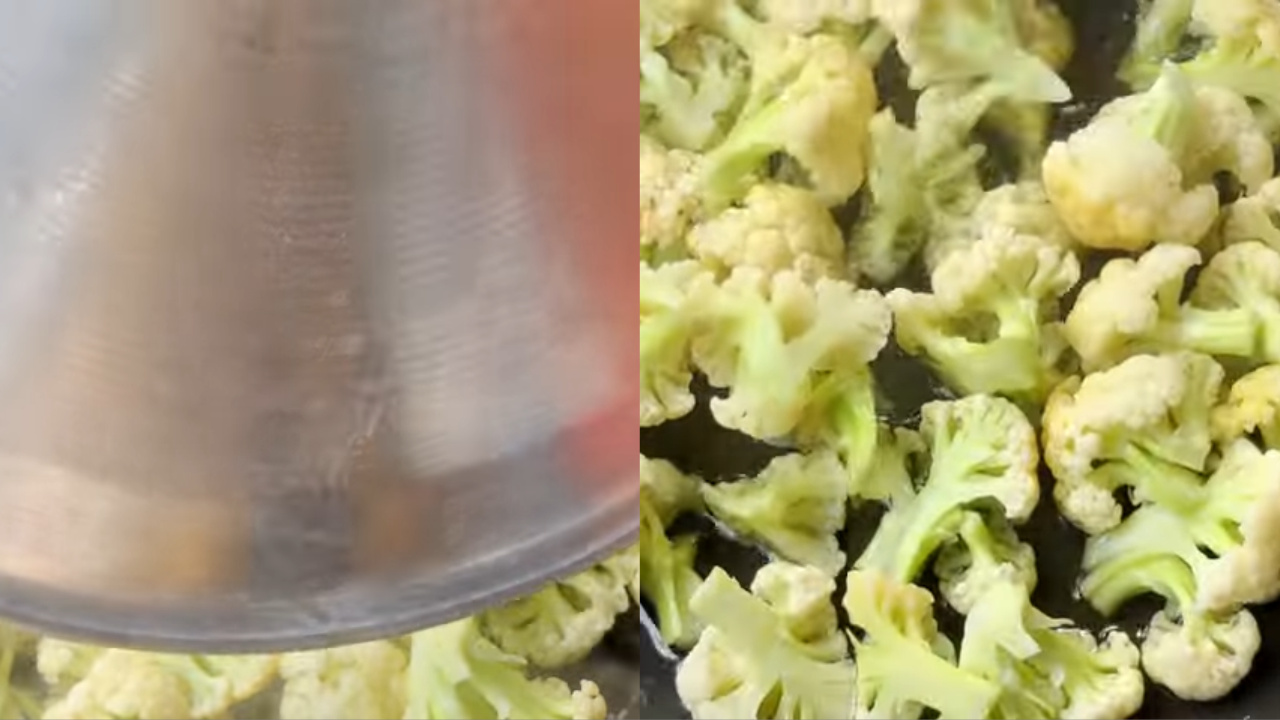 Opening the lid and stirring the cauliflower