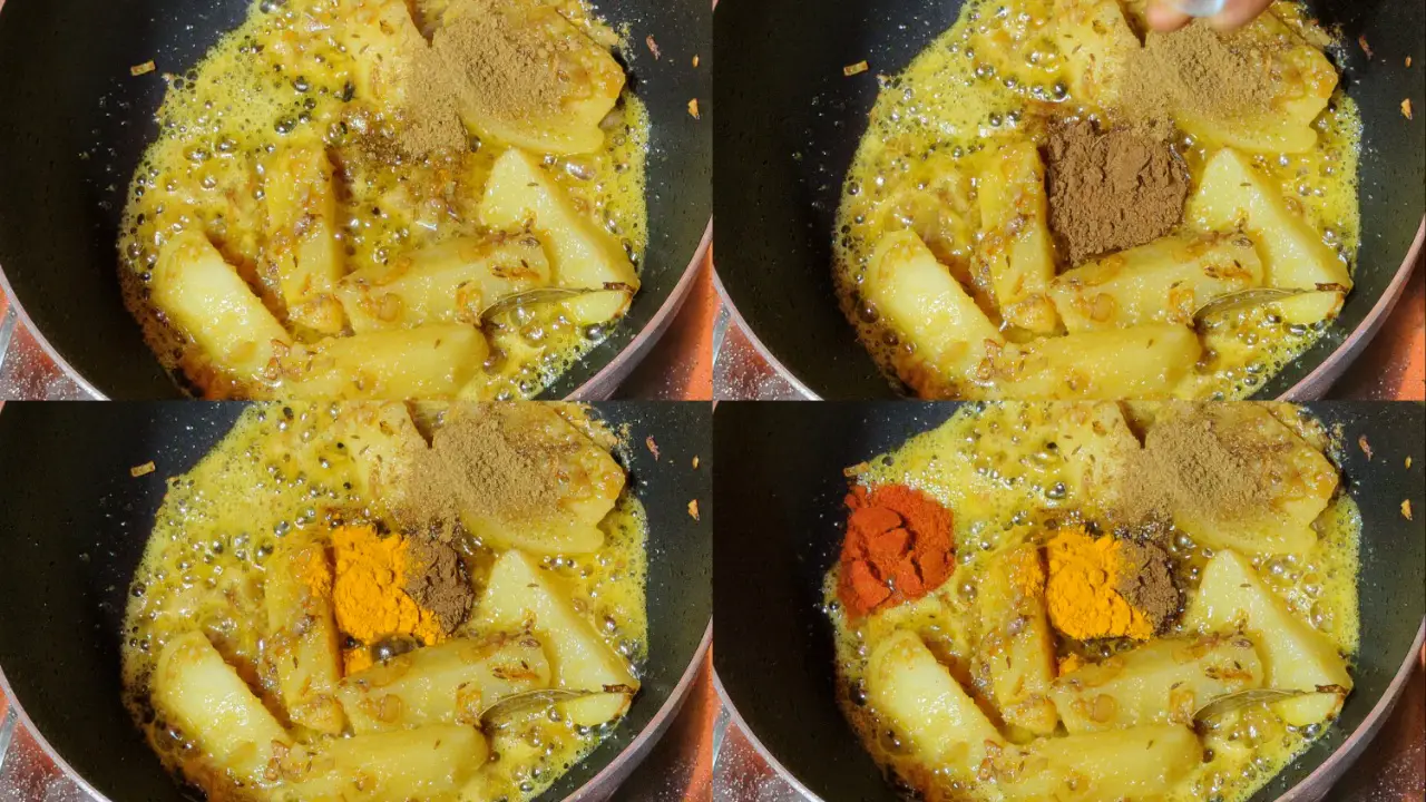 Adding the coriander powder, roasted cumin powder, turmeric powder, and red chili powder