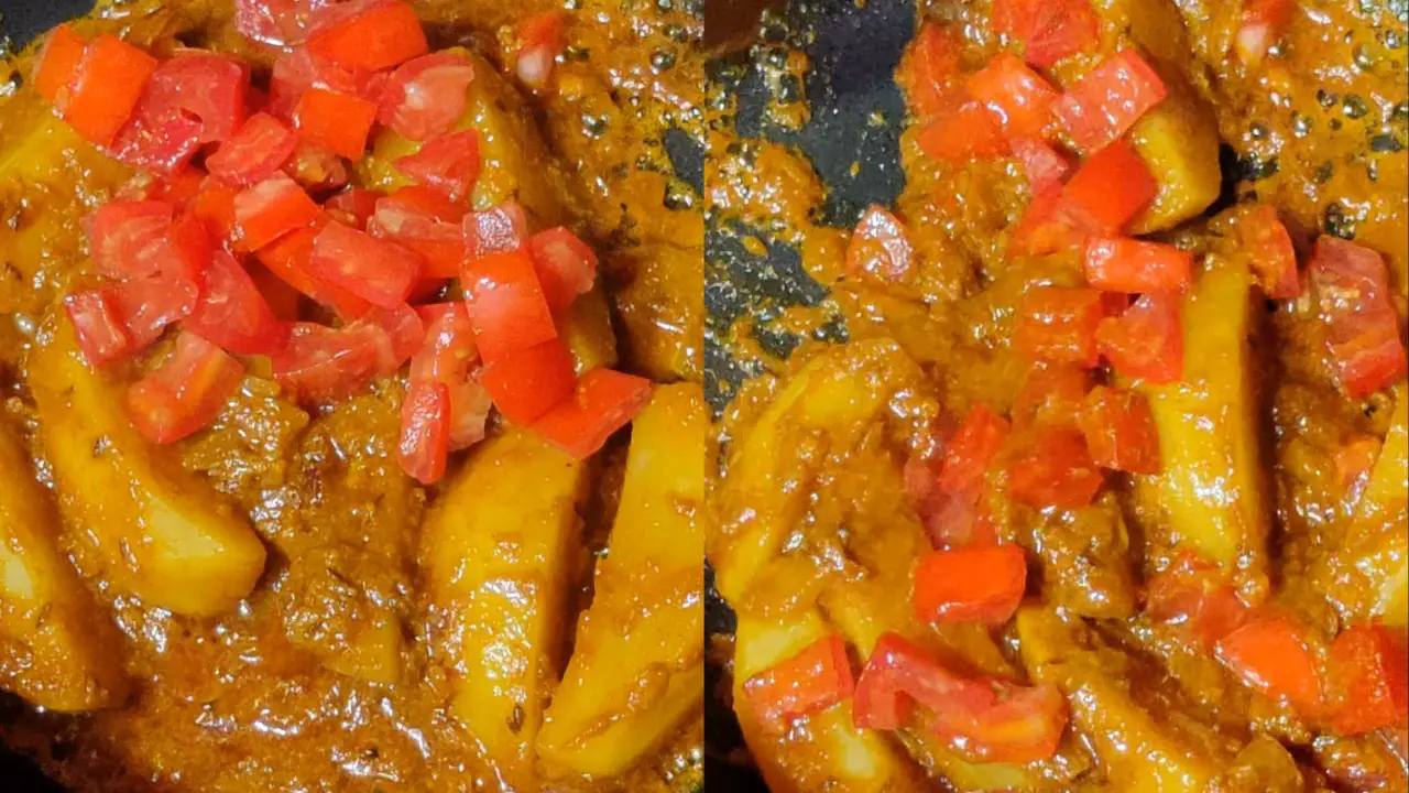 Adding the chopped tomatoes and stirring
