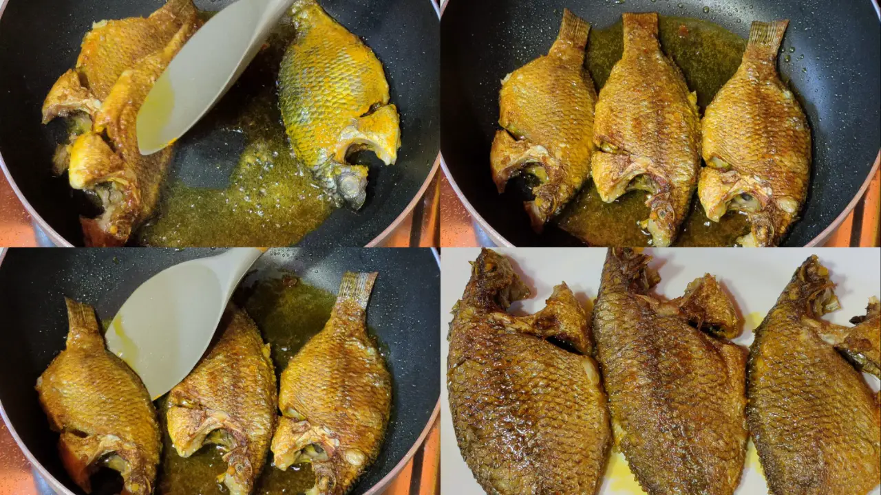 Taking out fried tilapia fish