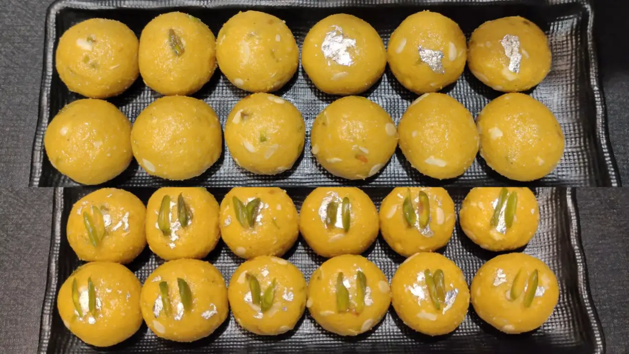 Garnishing Besan Ladoo with silver vark (tabak) and chopped pistachios