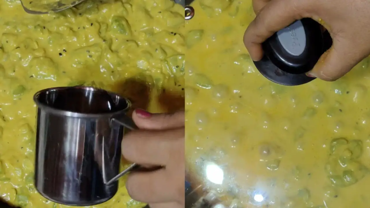 Adding water, and then covering the wok
