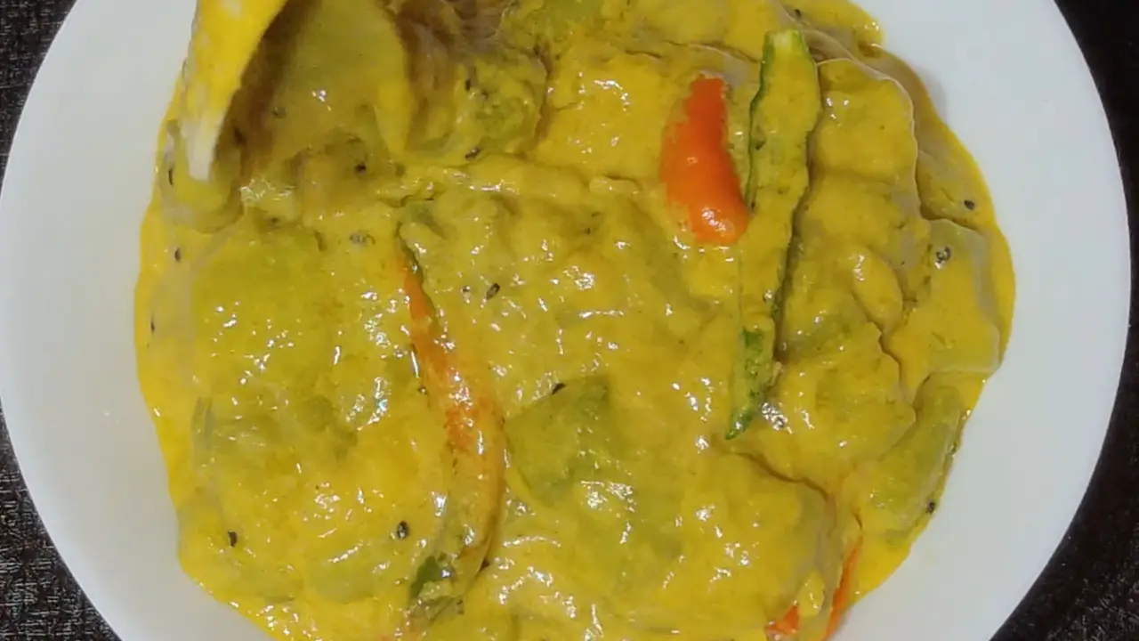 Transferring Jhinge posto to a serving bowl