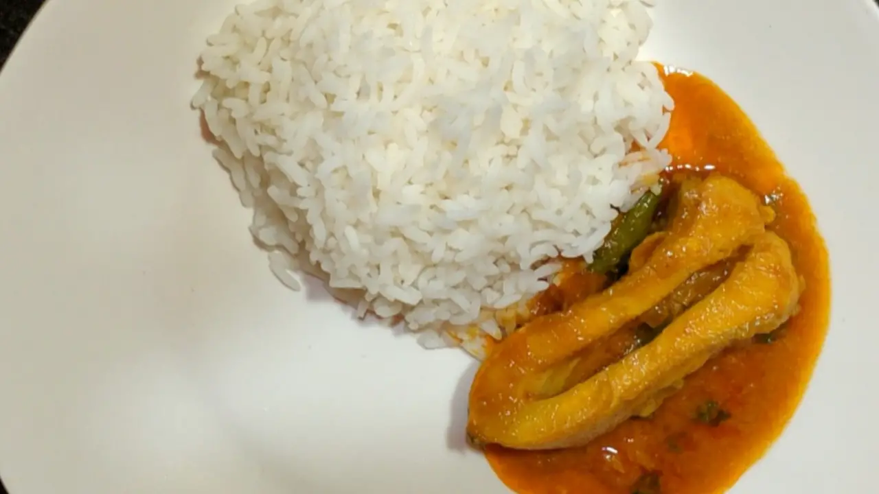 Serving Rupchanda Macher Jhol with steamed rice