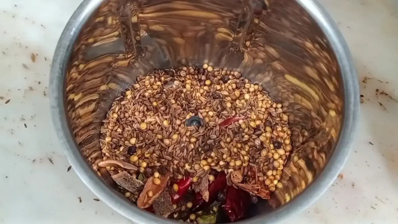 Adding ingredients in a grinder