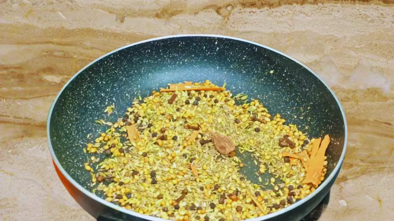 Adding 1 piece of black cardamom