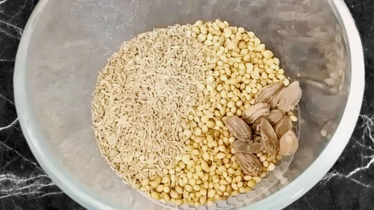 Adding 8 pieces of black cardamom