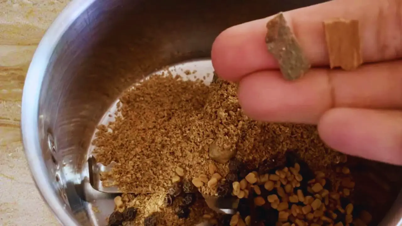 Adding 2 small pieces of cinnamon sticks