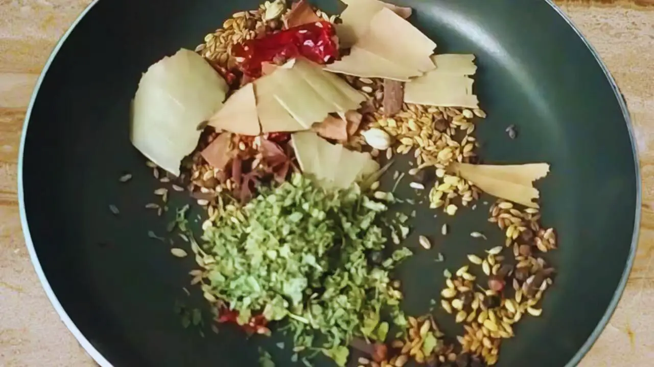 Adding the dried fenugreek leaves