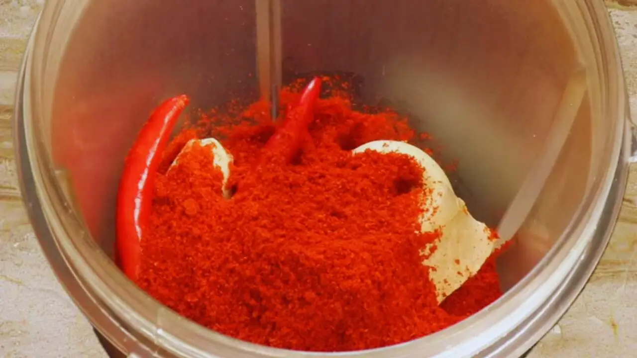 Adding 2 tbsp of Kashmiri red chili powder