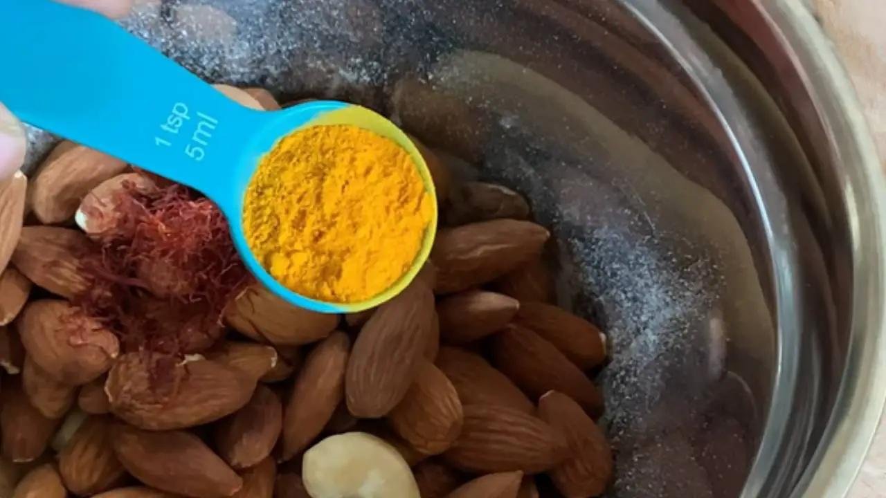 Adding ½ tsp of saffron and turmeric into it