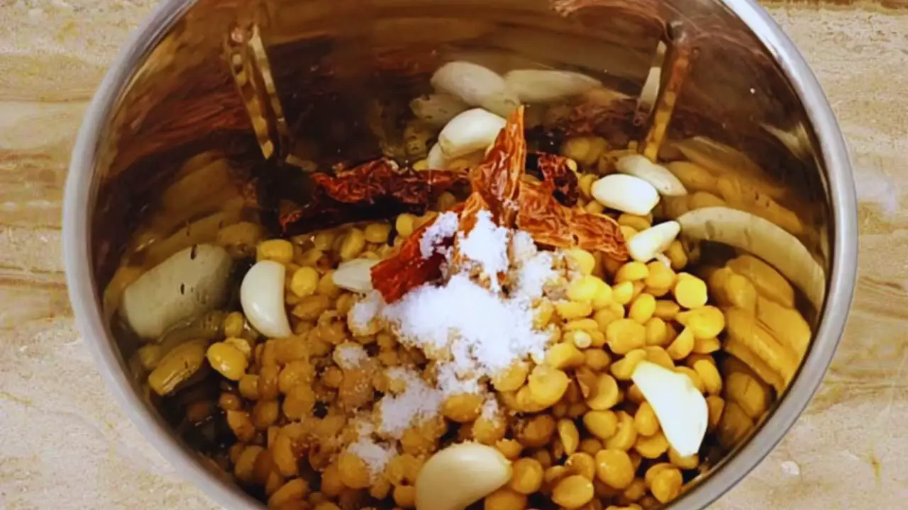 Adding about 1 tsp of regular salt to the split chickpeas