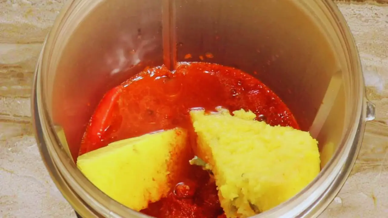 Adding 2 tbsp of water to the ingredients in the grinder