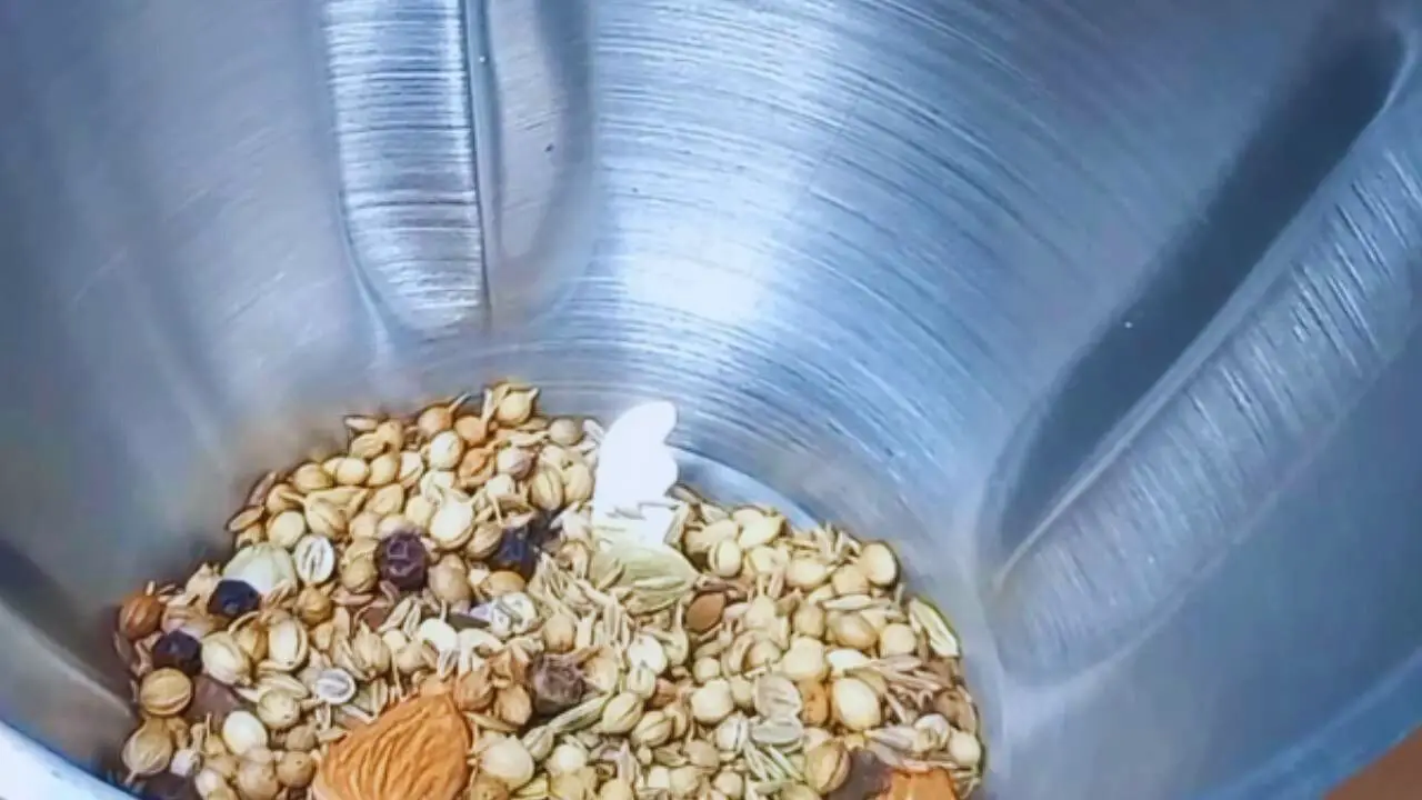 Taking a clean and dry grinder and pour the dry roasted spices into it