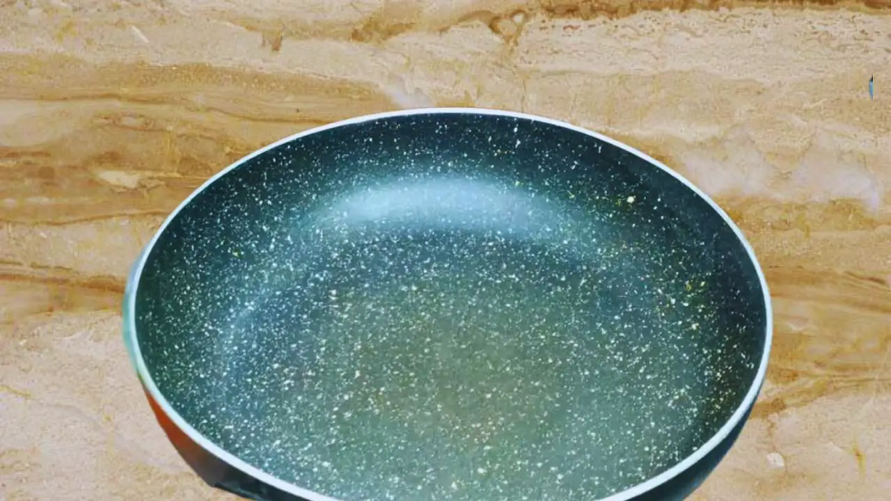 Heating a frying pan on a low flame
