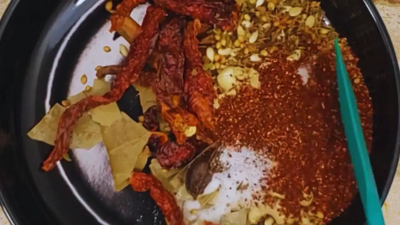 Mixing all the powdered masala with the ingredients on the plate nicely