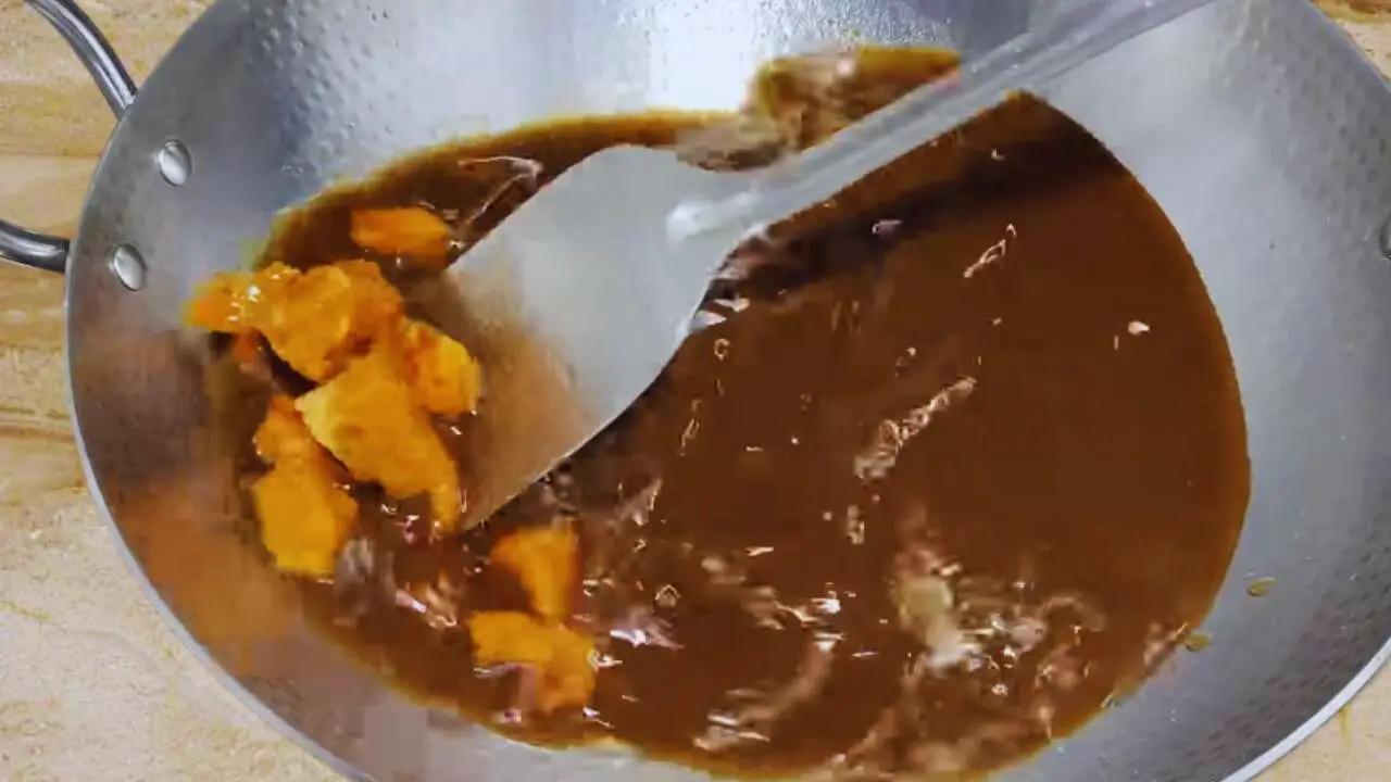 Mixing the jaggery nicely